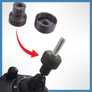 May include: An image shows three black 3D-printed parts, including a cylindrical piece with a threaded bolt attached. A red arrow indicates how the parts fit together. The parts appear to be components for a mechanical device.