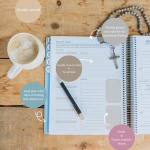 May include: A planner with a spiral binding, open to a weekly spread, sits on a wooden surface. A cup of coffee, a pen, and a rosary are also present. The planner includes sections for grocery lists, to-do lists, meal planning, and prayer requests.