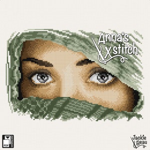 Pode incluir: Padrão de ponto cruz com um close-up dos olhos de uma mulher que olham por trás de um tecido verde. O padrão é intitulado "Anna's Xstitch" e inclui um par de tesouras.