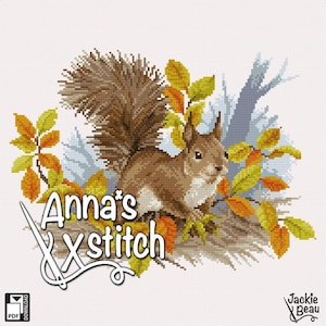 May include: Cross stitch pattern featuring a brown squirrel with a bushy tail sitting on a branch with autumn leaves. The pattern is titled "Anna's X Stitch" and includes a download icon.