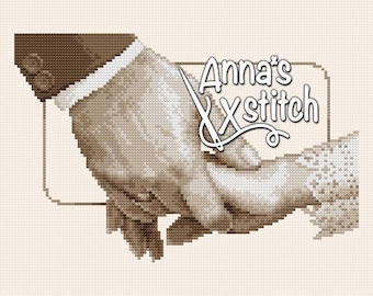 May include: A cross-stitch pattern featuring a sepia-toned image of two hands holding each other. The pattern is titled "Anna's Xstitch" and includes the text "Jackie Beau".