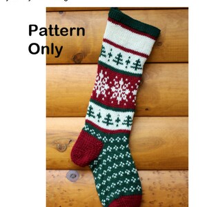 May include: A red, white and green knitted Christmas stocking with a snowflake pattern. The stocking is hanging on a wooden wall. The text "Pattern Only" is visible in the image.