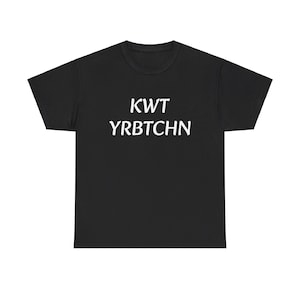 May include: Black t-shirt featuring the white text "KWT YRBCTCHN". The top has a crew neck and short sleeves. The material looks soft and comfortable. A casual, everyday garment.