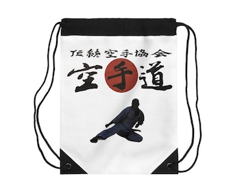 May include: White drawstring bag with black trim featuring a silhouette of a martial arts practitioner in a fighting stance. The bag has the text "正統空手道会 空手道" in black with a red circle behind the second character.