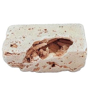 May include: A rectangular, off-white stone with a large, irregular cavity revealing a textured, brown interior. The stone has a porous surface with small holes and a rough, natural appearance.