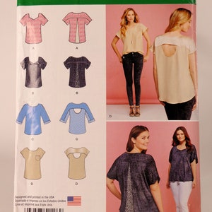 May include: Simplicity sewing pattern number 1106 A for a top with different neckline and back variations. The pattern includes instructions for making a top with a scoop neck, a keyhole back, and a back with a slit. The pattern also includes instructions for making a top with a scoop neck and a back with a keyhole. The pattern is designed and printed in the USA.