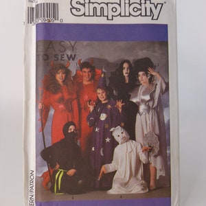May include: Simplicity pattern 934 for adult costumes. The pattern includes six costumes: a devil, a witch, a wizard, a ghost, a ninja, and a vampire. The pattern is labeled "Easy to Sew".