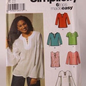 May include: Simplicity sewing pattern 5684 for 6 tops, sizes 8-14. The pattern includes instructions for making a variety of tops with different necklines, sleeves, and embellishments. The pattern is made easy with step-by-step instructions.