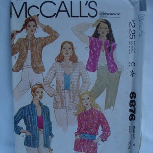 May include: A sewing pattern for four different blouses. The pattern is for a size 6, bust 30 1/4 inches. The pattern is from McCall's and is number 6876.