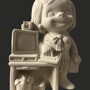 May include: A ceramic figurine of a smiling person at a desk with a computer and a basket. The figurine is unpainted and ready for customization. The person is wearing a bow tie and a skirt.