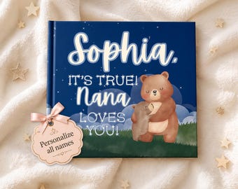 May include: A hardcover book with a dark blue night sky cover featuring a brown bear hugging a smaller bear. The text reads: Sophia. IT'S TRUE! Nana LOVES YOU! A light pink scalloped gift tag attached with a ribbon says: Personalize all names.