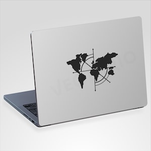 May include: A black world map design with a compass rose is displayed on the lid of a silver laptop. The laptop is open, revealing a keyboard. The design is a silhouette of the continents and oceans.