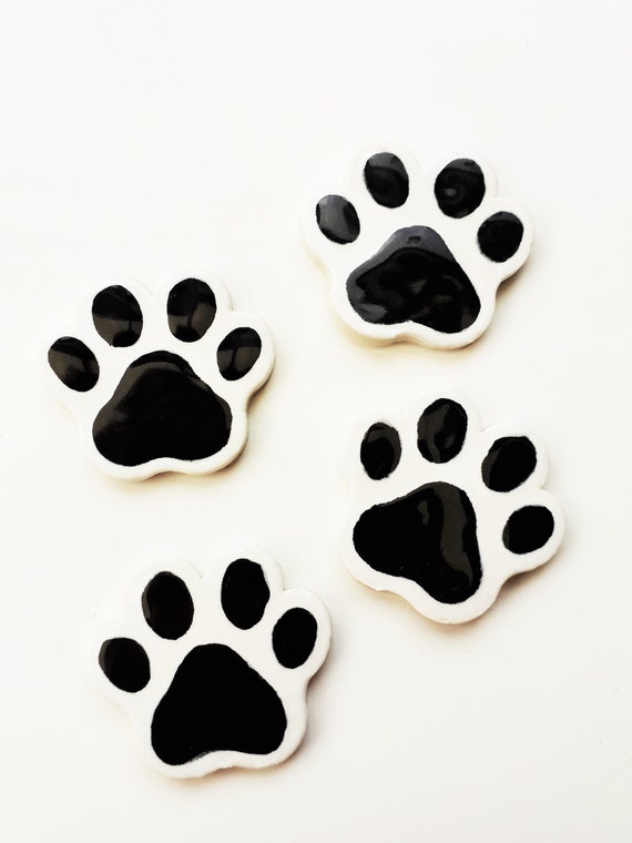 4 ceramic pawprint tiles , great for mosaic or similar craft projects
