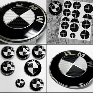 May include: A set of eight black and white BMW car emblems with a carbon fiber pattern. The emblems are in various sizes and are perfect for replacing old or damaged emblems.