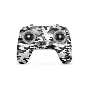 May include: A drone remote control featuring a white, grey, and black camouflage design. The controller has two joysticks, several buttons, and the DJI logo. The pattern is a blend of digital and military camouflage.
