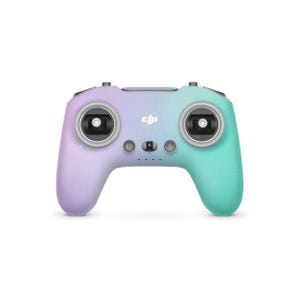 May include: A gradient drone controller in purple and teal, with a speckled finish. The controller has two joysticks, several buttons, and the DJI logo. The design is symmetrical, with a rounded shape for comfortable handling.