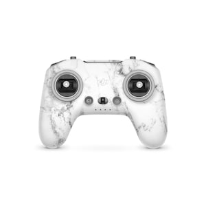 May include: A white and grey marble-effect drone controller featuring two joysticks, buttons, and the DJI logo. The controller has a curved design and is set against a white background.