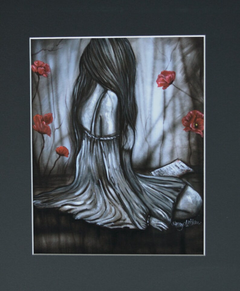 Sad woman portrait done in black and gray. Gray background with red flowers. Woman has a note and is sadly looking away from viewer. If you love something set it free. Black mat surrounds reproduction print. 11’ x 14” and 16’ x 20”