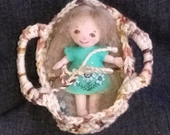 Hand-crocheted basket bed for 4" felt doll, with mattress and pillow