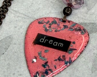 Guitar Pick Necklace DREAM  embedded in pink background with Glitter Accents , Long Layering Necklace