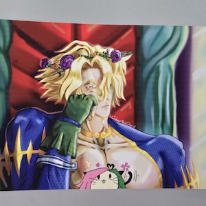 May include: A colorful illustration of a character with blonde hair wearing a flower crown and a blue and gold outfit. The character is holding a green glove to their face. A cartoon cat is visible on the character's chest.