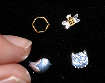 One tiny sterling silver stud earring—fauna—to mix and match!