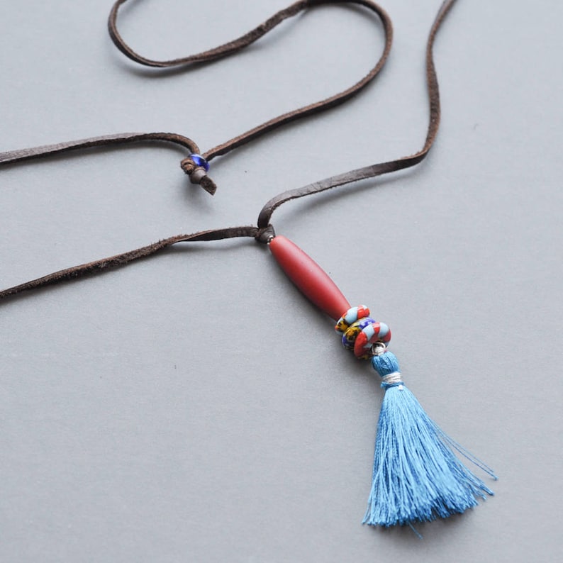 Adjustable soft leather cord with barrel bead and tassel