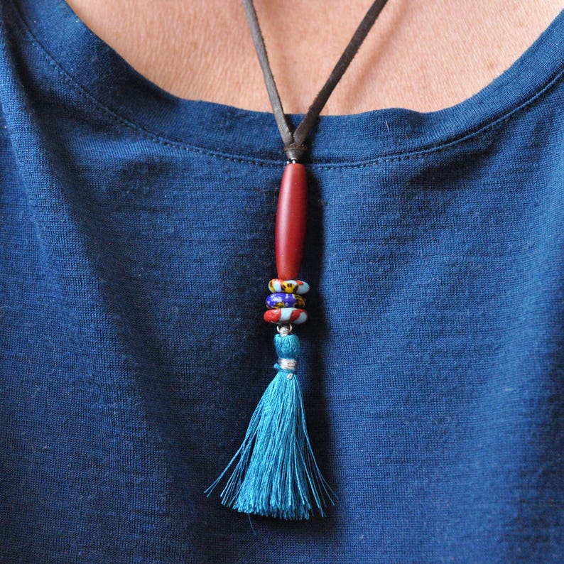 Adjustable soft leather cord with barrel bead and tassel