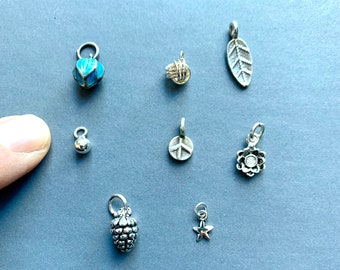 One tiny sterling silver pendant or charm to add to itty bitty necklace or bracelet