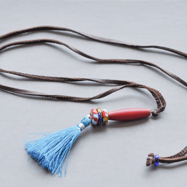 Adjustable soft leather cord with barrel bead and tassel