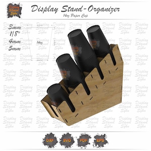May include: A wooden display stand-organizer for 14oz paper cups. The stand has multiple slots to hold the cups and is made of light brown wood. The text "Display Stand-Organizer" and "14oz Paper Cup" are visible.