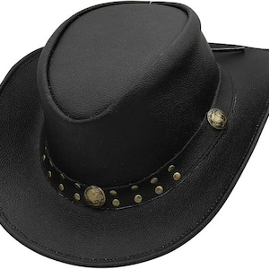 May include: Black leather cowboy hat with a rounded crown and a wide brim. The hat features a decorative band with small, round, brass-colored studs and two larger, ornate buttons. The hat is a classic Western style.