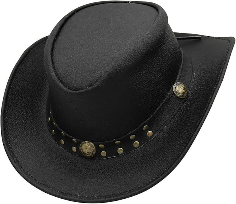 May include: Black leather cowboy hat with a rounded crown and a wide brim. The hat features a decorative band with small, round, brass-colored studs and two larger, ornate buttons. The hat is a classic Western style.