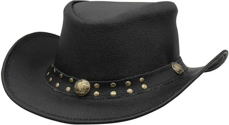 May include: Black cowboy hat with a slightly curved brim. The hat features a decorative band with brass-colored studs and two round, brass-colored medallions. The hat is made of a textured material, likely leather.