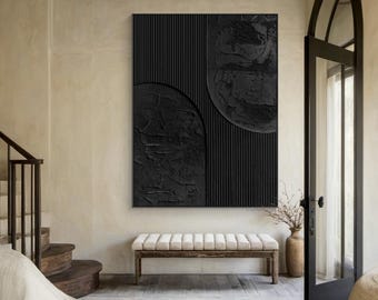 May include: A black and white abstract painting with geometric shapes and textured surfaces. The painting is hanging on a wall in a modern home.