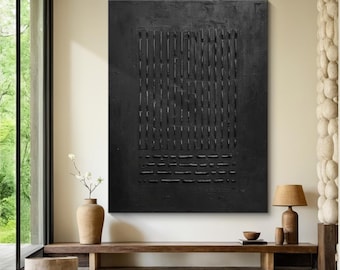 Puede incluir: Una pintura abstracta en blanco y negro con una superficie texturizada. La pintura presenta un patrón de cuadrícula de líneas y cuadrados.
