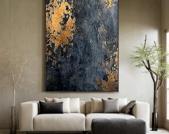 May include: Abstract painting with a dark blue background and gold accents. The painting has a textured surface and is framed in a black frame.