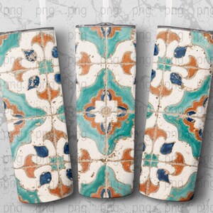 May include: Three stainless steel tumblers with a decorative tile pattern. The design features a repeating pattern of white, teal, orange, and blue shapes. The tumblers are cylindrical and have a silver rim.