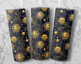 May include: Three insulated tumblers with a repeating pattern of gold sun faces, stars, and celestial designs on a navy blue background. The design has a vintage, celestial theme.