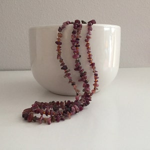 Long double-stranded amethyst and glass bead necklace.