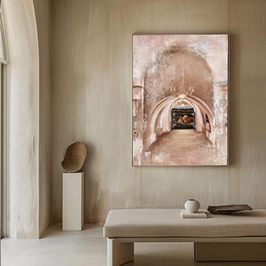 May include: A large rectangular wall art piece featuring an impressionistic painting of a stone archway with a chandelier and a dark framed picture in the distance. The artwork uses a palette of beige, cream, and soft pink tones with textured brushstrokes.