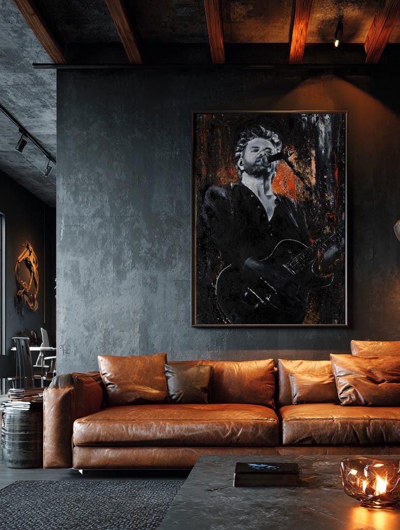 May include: A rectangular wall art print featuring a black and white portrait of a musician singing into a microphone while playing an electric guitar, accented with textured dark tones and subtle hints of orange and red throughout the composition.