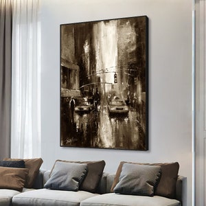 May include: A sepia-toned abstract painting of a city street scene with two cars and pedestrians. The painting has a textured, brushstroke effect and a light background.