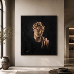 May include: A square framed oil painting depicting a classical bust of a man with curly hair and a beard, rendered in warm golden and brown tones against a deep black background. The figure is draped in a simple garment over one shoulder.