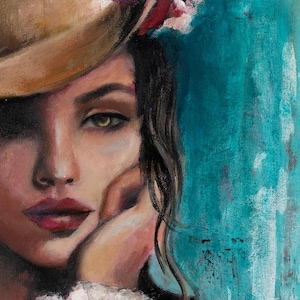 May include: An oil painting on canvas depicting a portrait of a person with dark hair, wearing a tan hat adorned with purple and pink flowers. The subject has a hand resting against their cheek, wearing a white ruffled cuff against a teal background.