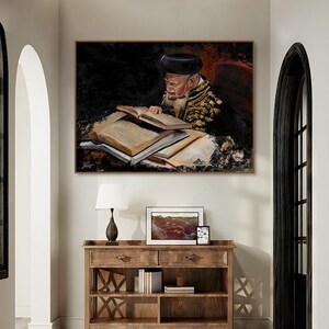 May include: A rectangular wall art print featuring an oil painting of an elderly person with a white beard wearing a black hat and dark embroidered robe, reading from a stack of open books. The artwork uses dark tones with gold accents.