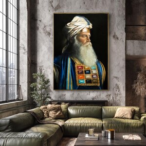 May include: A framed portrait painting of a bearded individual wearing a white turban and a blue robe with a gold-trimmed chest piece featuring twelve colourful square gemstones arranged in a grid against a solid black background.