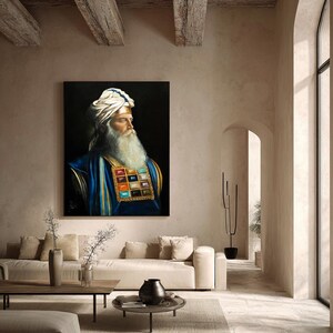May include: A square wall art print featuring a portrait of a bearded individual wearing a white turban with blue accents and a blue garment adorned with a large rectangular chest piece containing a grid of colourful, square-shaped gemstones.