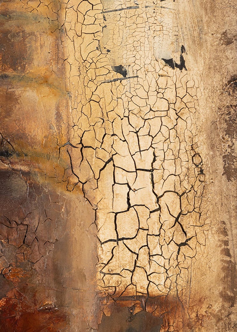May include: A textured surface featuring a prominent crackled finish in shades of cream and beige. The central area displays a dense network of dark, irregular fissures contrasting against the lighter, weathered paint layers, creating a distressed, aged appearance with deep brown and earthy tones visible along the edges.