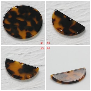 May include: Four tortoise shell plastic pieces with holes for hanging. Two are round and two are half circles.